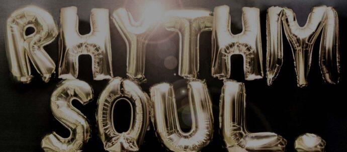 Tekoälyllä luotu kuva kultaisista kirjainilmapalloista, joista muodostuu sanat "Rhythm" ja "Soul".